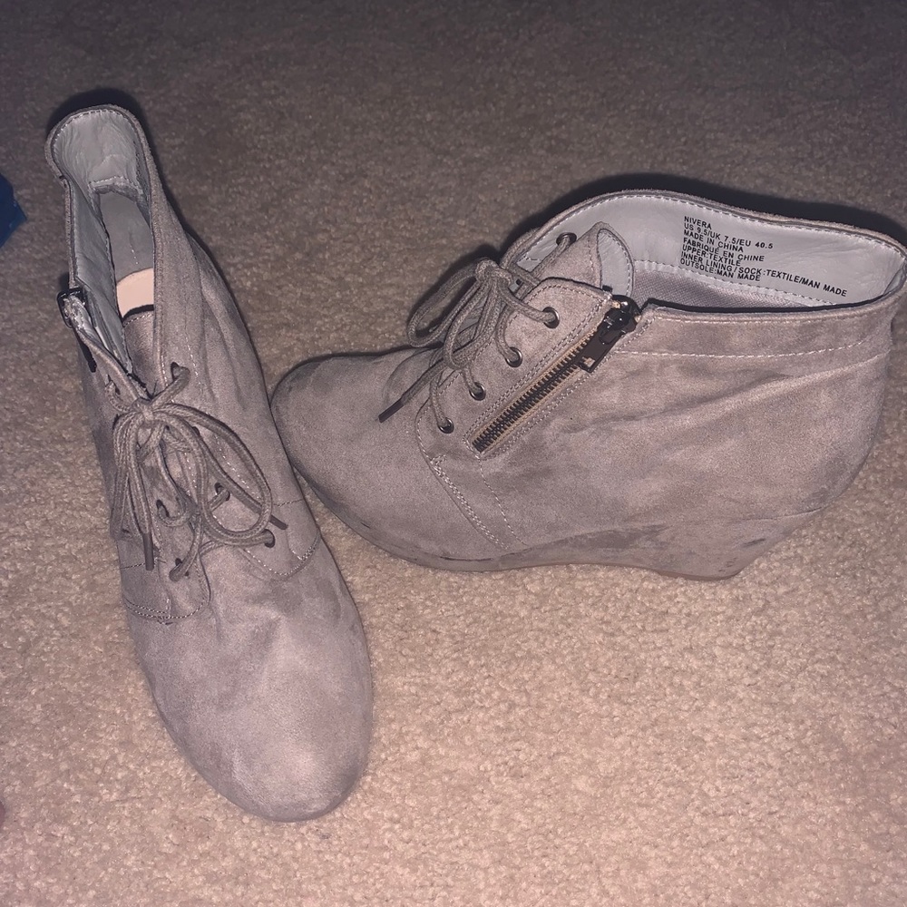 Worn a couple times beige wedged booties